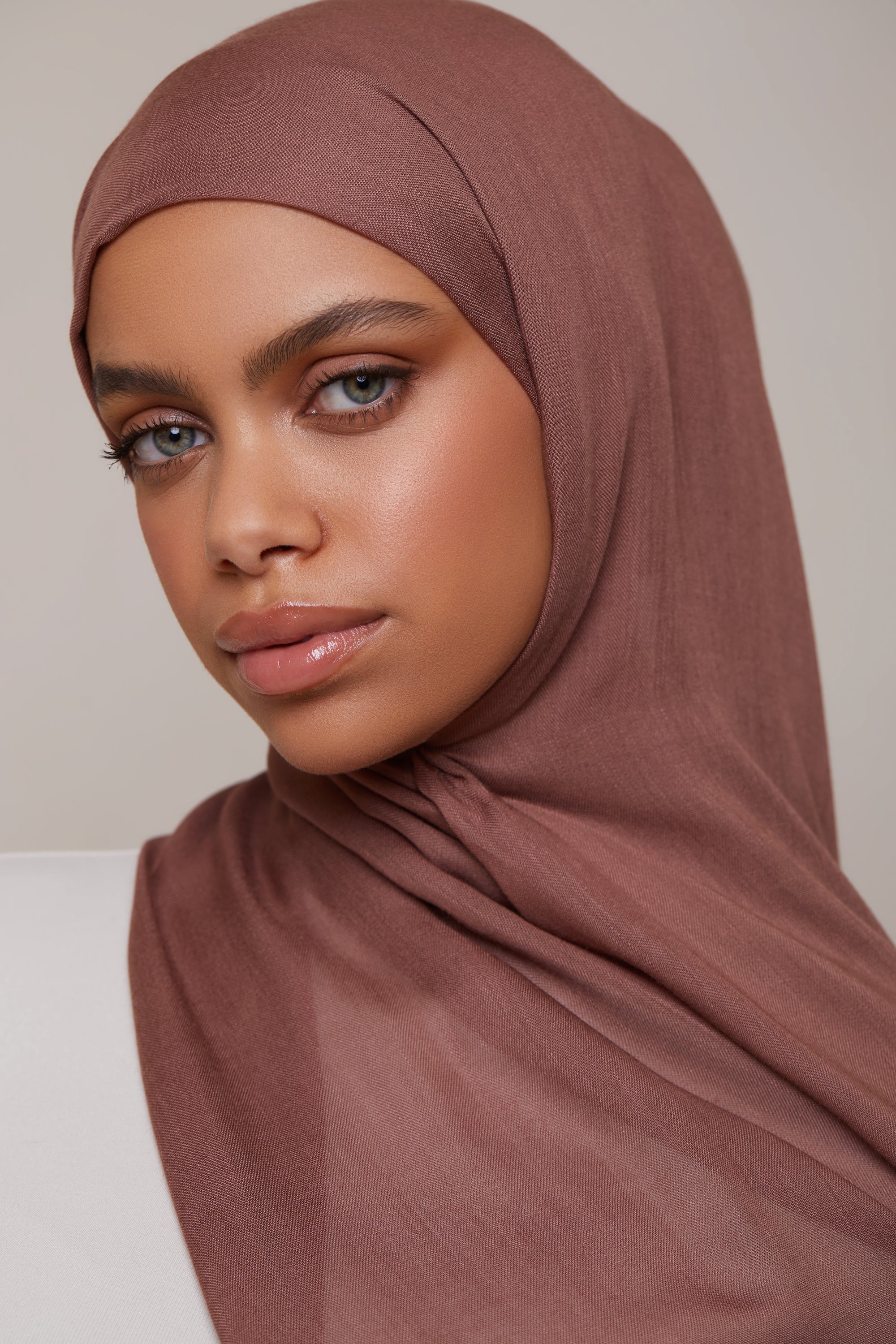 Girl wearing pecan Modal Fabric Hijab, shop online at Hijabandco Pakistan.